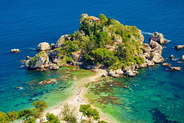 A stunning aerial view of Isola Bella in Taormina, with its turquoise waters and sandy natural isthmus.